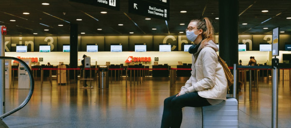Masked traveler at airport